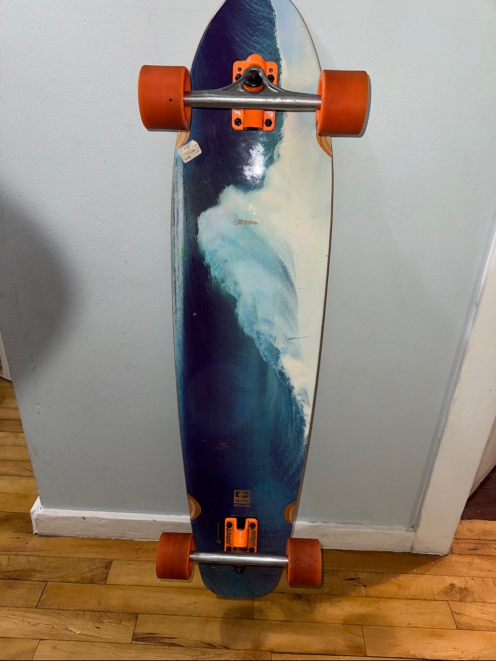 Globe Longboard with Blue Wave Deck and Orange Wheels